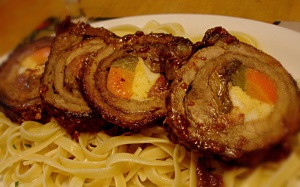 La Morcon Caviteño.  A beef roulade of boiled egg, sausage and vegetables braised in tomato sauce
